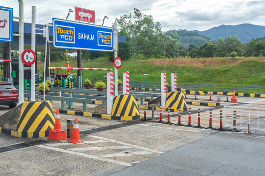 Driving on a road blocked by a barrier in a Malasyan rural area