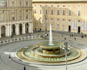 Genoa, Italy - January 24, 2025. Piazza Ferrari with fountain in Genoa. Buildings and architecture of old town. View from above on sunny winter day in 2025. 
