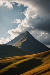mountains with a few clouds in the sky and a lone horse in the foreground