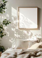 White poster frame mockup in a bedroom, grey walls, a plant on a nightstand table, a cozy bed with white pillows and a blanket