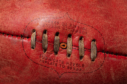 Close up macro of top stitching of AFL football 