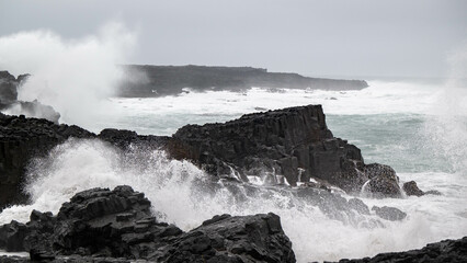 waves crashing on rocks