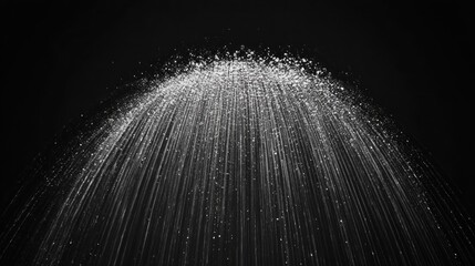 Water spray arc against black background