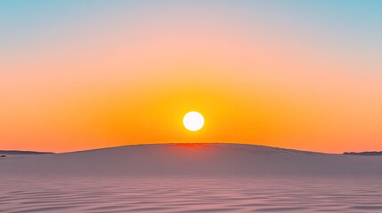 Obraz premium Serene sunset over tranquil sand dunes with vibrant colors reflecting on the horizon