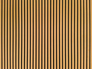 Background with lots of vertical and yellow stripes. Striped wooden texture.