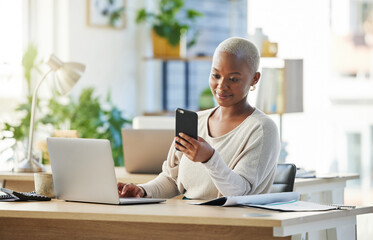 Business, laptop and black woman in office, smartphone and texting with communication. African...