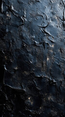 Textured black background with rough, uneven surface, showcasing mix of matte and glossy finishes, creating dramatic and moody atmosphere