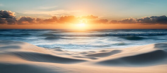 A deserted beach with soft sand dunes gentle waves and a vibrant sky