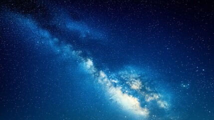 Fototapeta premium Starry Night Sky with Milky Way Galaxy Over Dark Blue Background