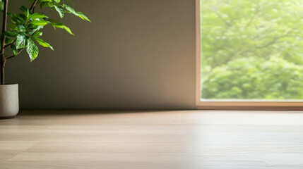 Green indoor plant near a bright window with a view of nature