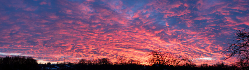 Breathtaking Panoramic Sunset with Fiery Clouds Over Countryside