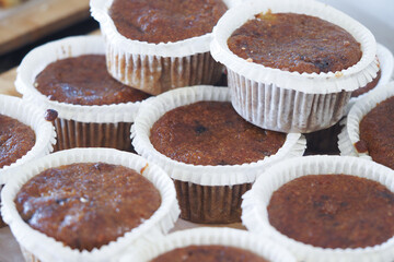 Freshly baked muffins piled on a tray at a local bakery