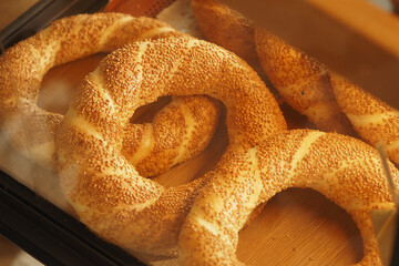 Freshly baked sesame covered bread at local bakery in afternoon light