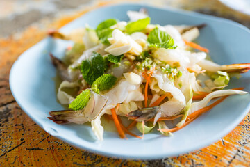 Shrimp in fish sauce, hot and spicy seafood. Raw shrimp and spicy sauce, seafood Thailand. Shrimps chilled in fish sauce with vegetable and spicy sauce Thai food