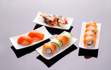 Assorted sushi and maki rolls beautifully arranged on plates