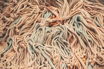 A pile of white and blue yarns with a lot of knots