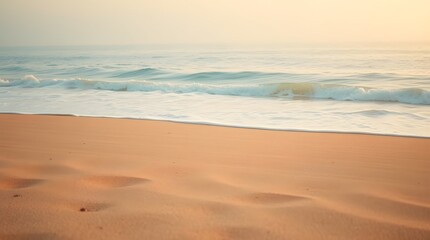 Gentle Waves Washing Ashore on Sandy Beach at Sunrise