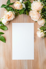 Blank A4 Paper on Wooden Table Surrounded by Light Pink Roses