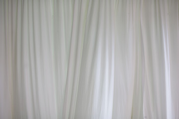 The white curtains are wavy and flowing.