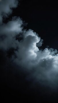 Thick fog rolling across a deep black background, with soft, billowing clouds of smoke 15