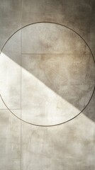 Abstract circular pattern on textured concrete surface illuminated by diagonal light