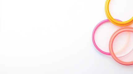 Colorful transparent rings arranged on a white background, creating a playful and vibrant atmosphere