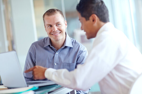Employees, laptop and team plan for human resources in office, review candidates and applications. Men, discussion and collaboration with hiring recruitment process, online and advice for decision