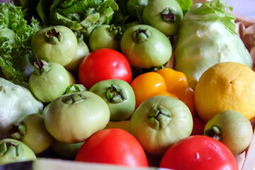 Variety of fresh vegetables in a wooden box. Selective focus.