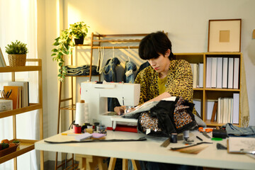 Fashion designer sewing custom garment in a creative studio