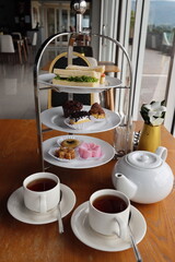 afternoon hitea tower with various delicious cake
