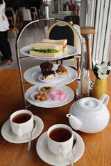 afternoon hitea tower with various delicious cake