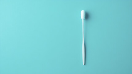 cotton swab lies on solid teal background, showcasing its simple design and functionality. This captures essence of everyday hygiene products in clean and minimalistic way