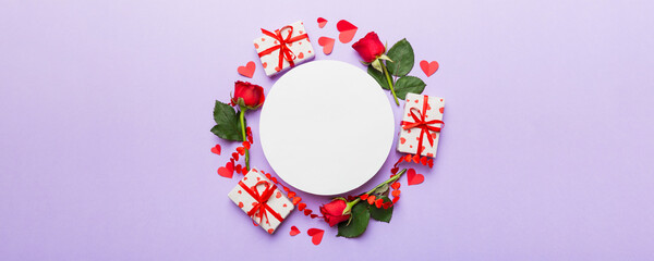Frame made of rose, git box, heart and blank greeting card mockup on Colored background. Top view, flat lay, copy space Holiday, Mothers Day, birthday concept