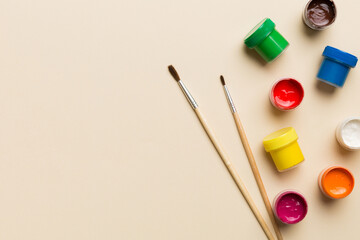 art palette with paint and brushes, close up. Top view with empty space. workplace for creativity....
