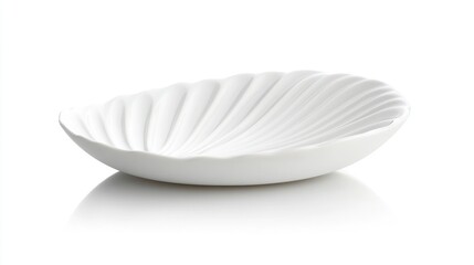 White shell-shaped bowl on white background, studio shot, for website design
