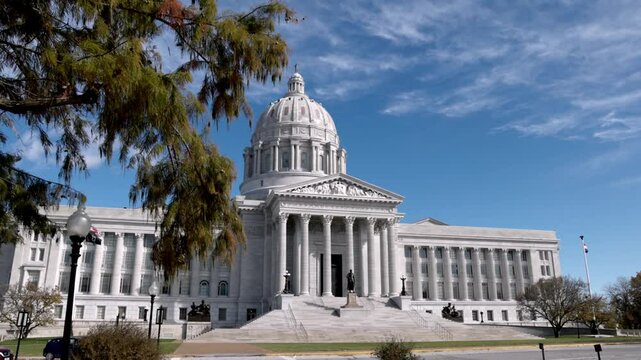 Missouri state capitol building in Jefferson City, Missouri with wide gimbal video walking forward.