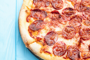 Pizza pepperoni fast food . Top view on rustic background