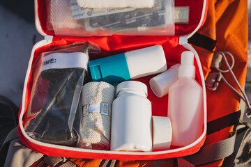 An individual is carrying a meticulously organized first aid kit inside their backpack for added...