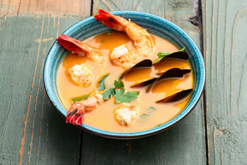 French seafood bouillabaisse soup with shrimps and mussels photography . Top view