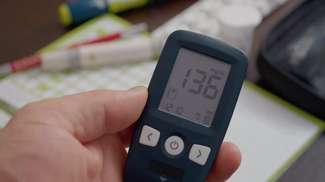 A blood sugar test reveals a high glucose level, raising concerns about diabetes management. The glucometer shows 136 mg/dL, highlighting the need for monitoring and care.