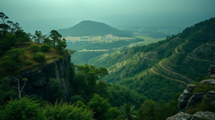 Misty Green Peaks: Aerial View of Lush Mountains, Foggy Valleys, and a Distant Lake