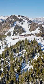 Aerial drone view of Col dei Baldi, Alleghe, in the Dolomites, Italy in daylight. Vertical