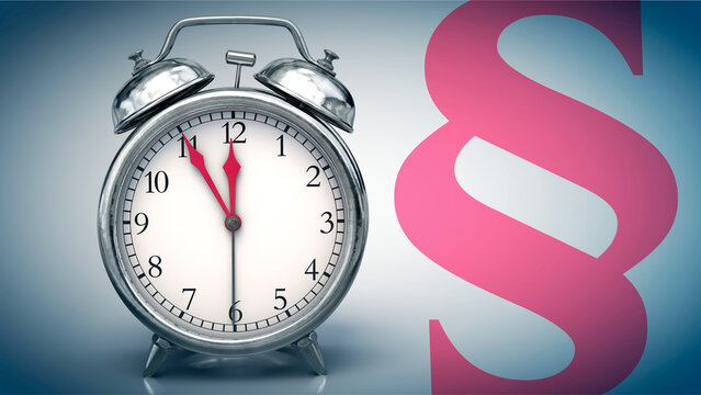 5 vor 12 auf Wecker und Paragrafenzeichen