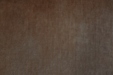 Brown textured fabric featuring subtle variations in tone and pattern