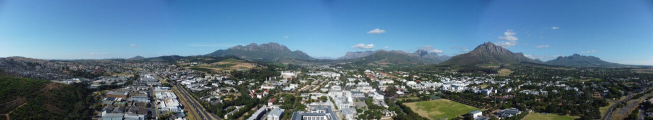 Fototapeta premium Stellenbosch Town South Africa Aerial Panorama with mountains in the background.