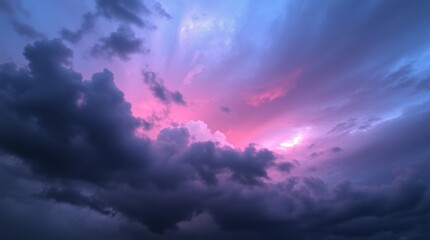 Obraz premium Dramatic Sunset Sky with Swirling Storm Clouds and Vibrant Pink-Purple Hues