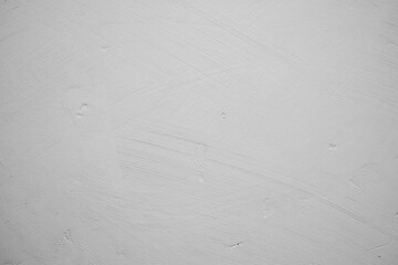 Textured white wall with subtle pattern and soft shadows in interior space