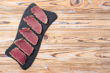 Sliced tuna steak with sesame photography . Top view