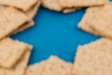 Passover celebration with matzah arranged in a star shape on blue table