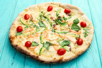 Italian pizza with avocado salmon  tomatoes and mozzarella photography. top view